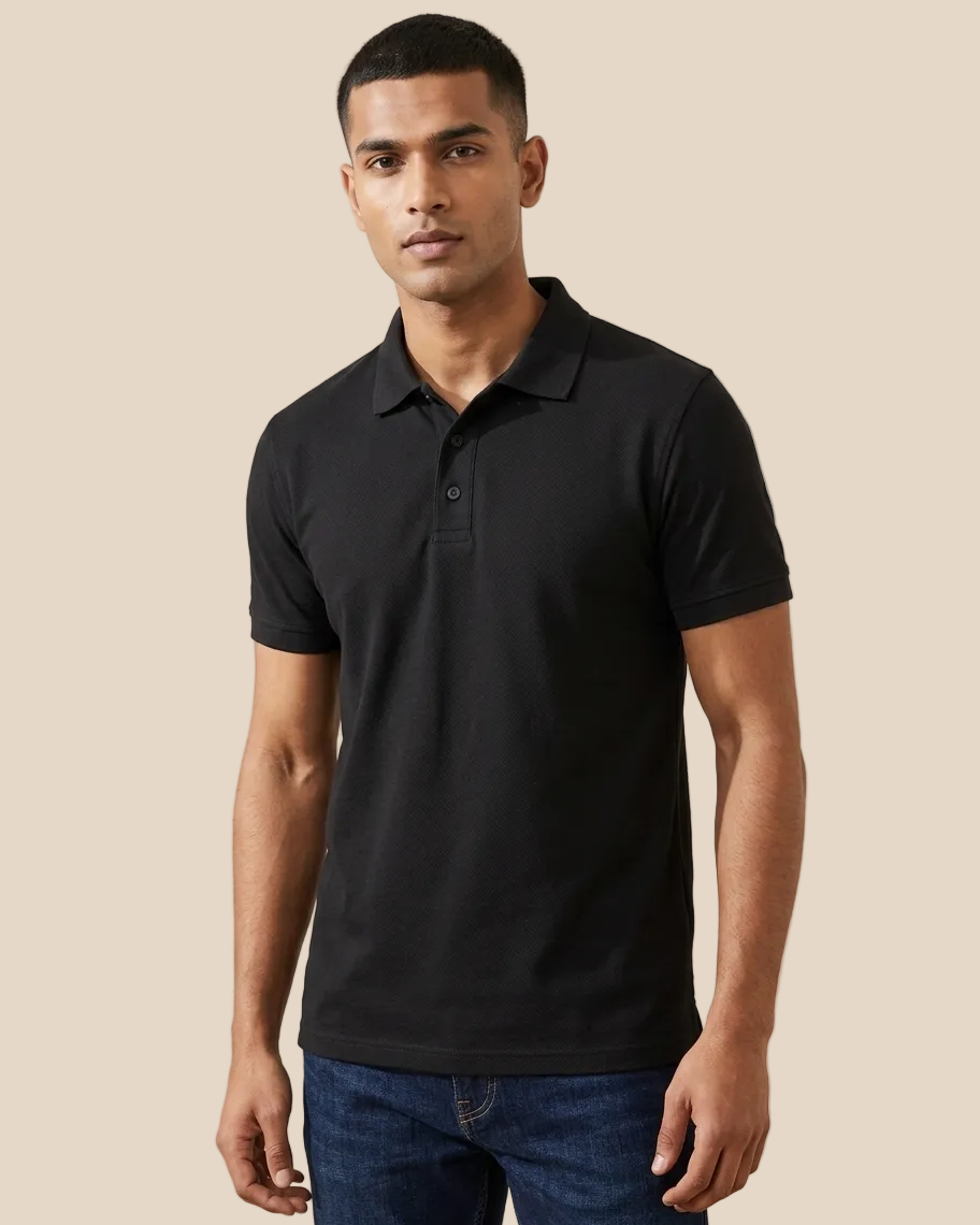 Man wearing a black polo shirt against a white background