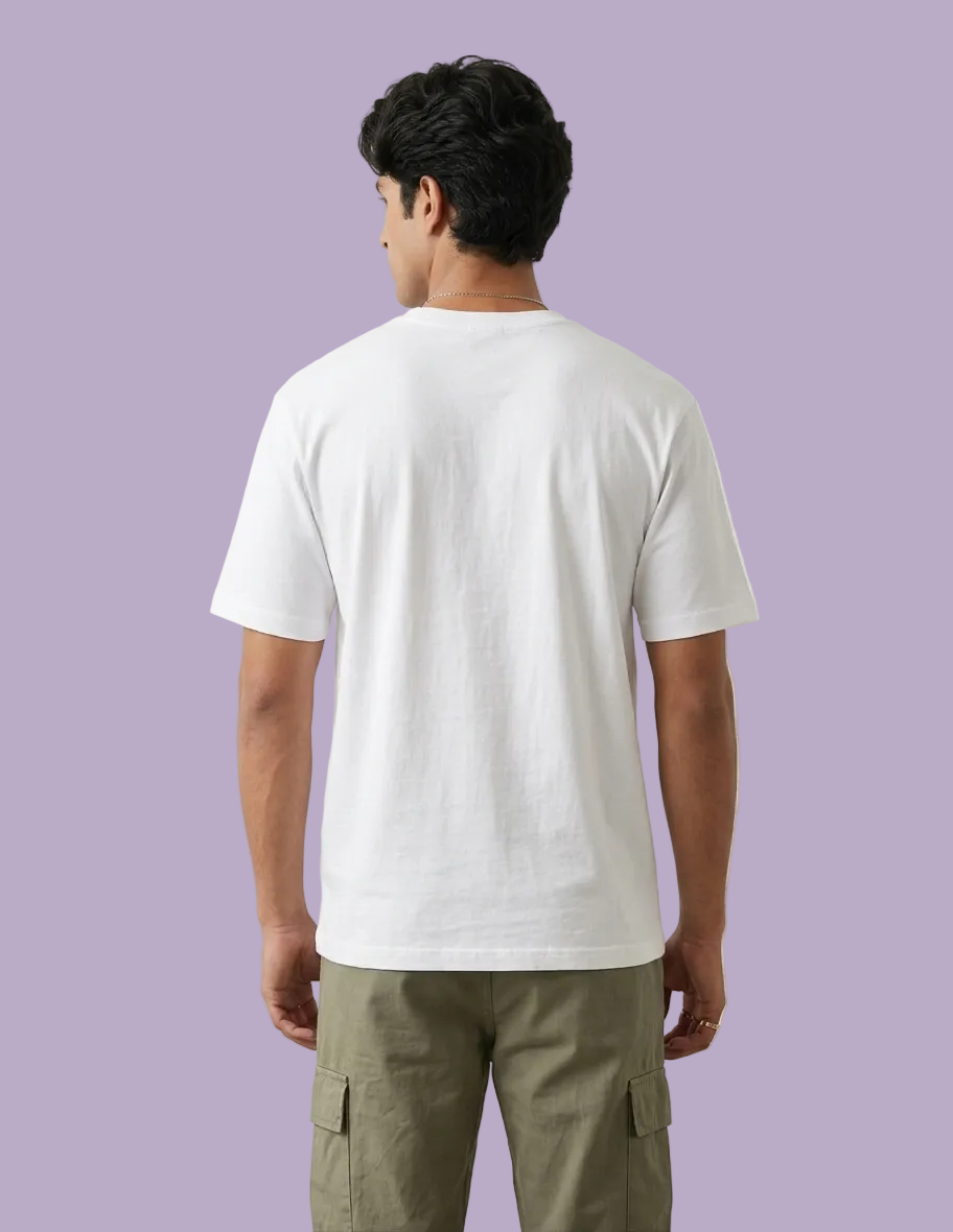 Person wearing a white t-shirt and green cargo pants on a plain background