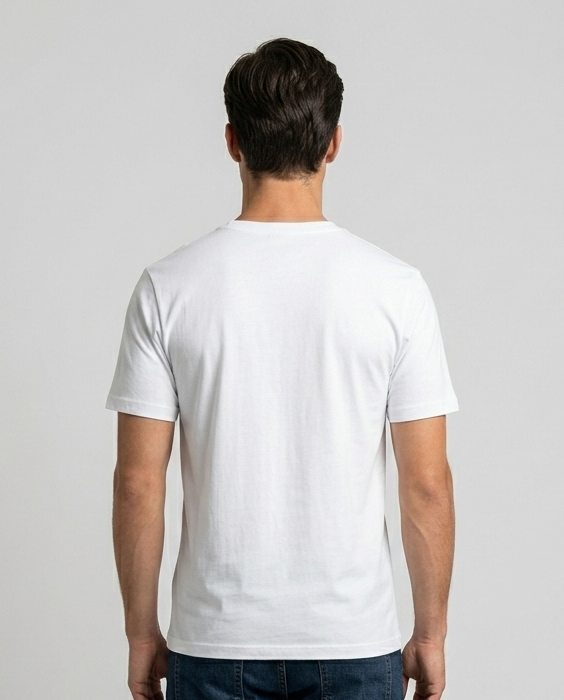 Person wearing a plain white t-shirt and dark jeans on a light gray background