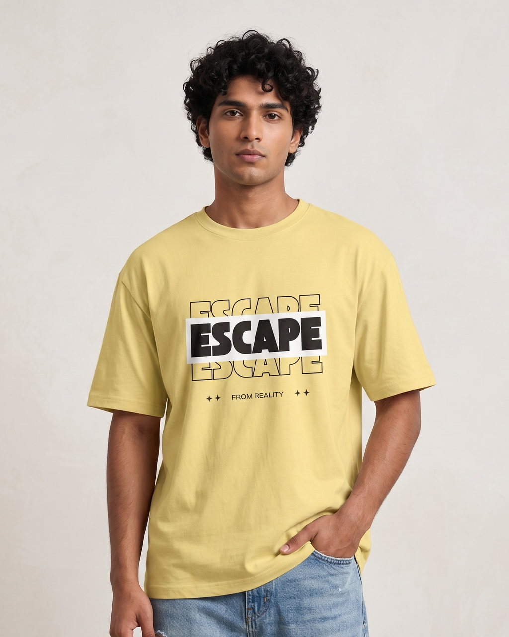 Man wearing a yellow t-shirt with 'ESCAPE' text on a plain background
