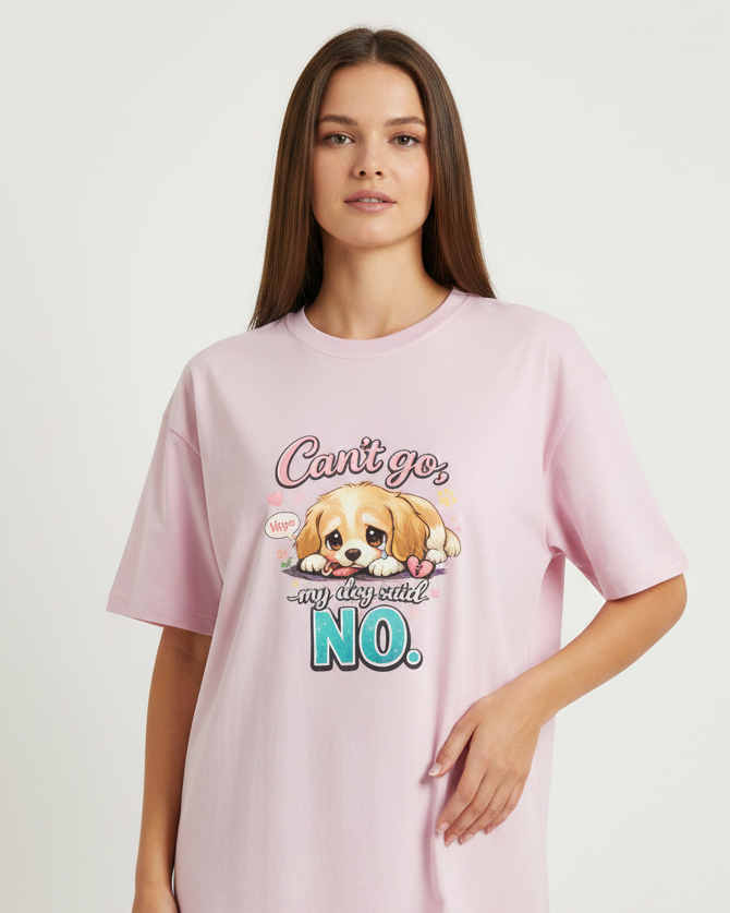 Woman wearing a pink t-shirt with a dog graphic and text on a white background