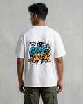 Person wearing a white t-shirt with 'Game Over' design on the back, standing against a plain background.