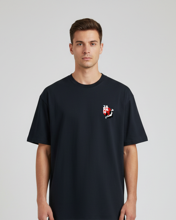 Man wearing a black t-shirt with a small graphic on a white background