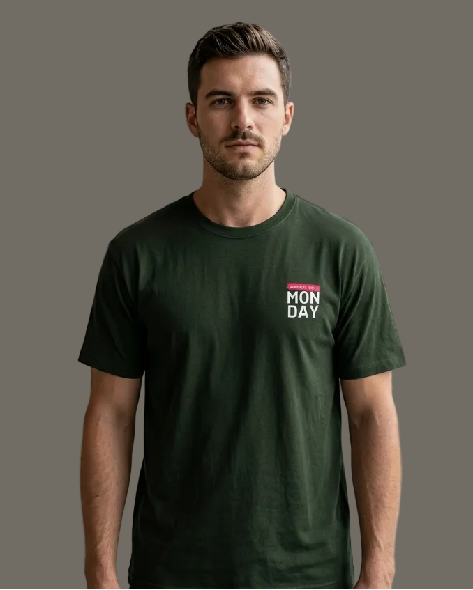 Man wearing a green t-shirt with 'MON DAY' logo in a grey background
