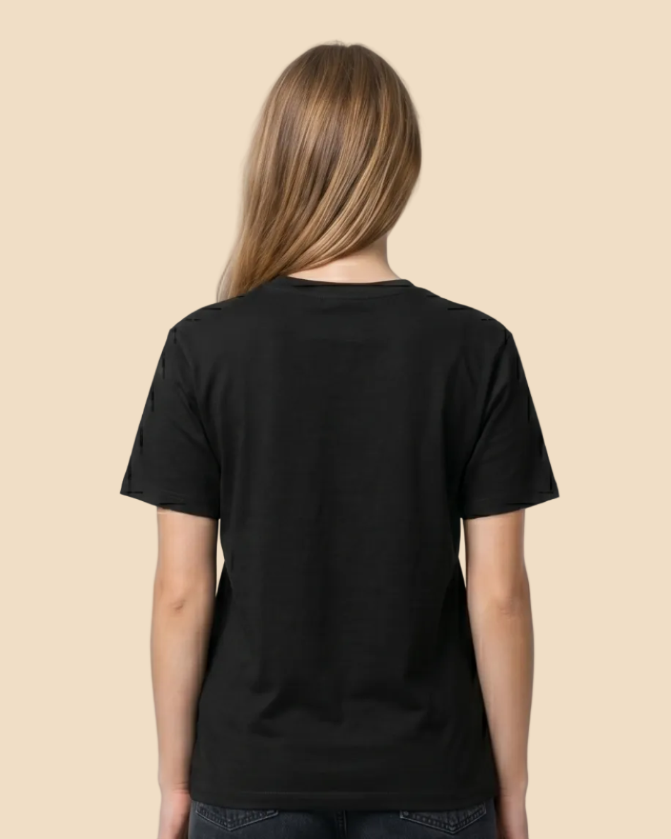 Person wearing a black t-shirt and dark jeans on a white background