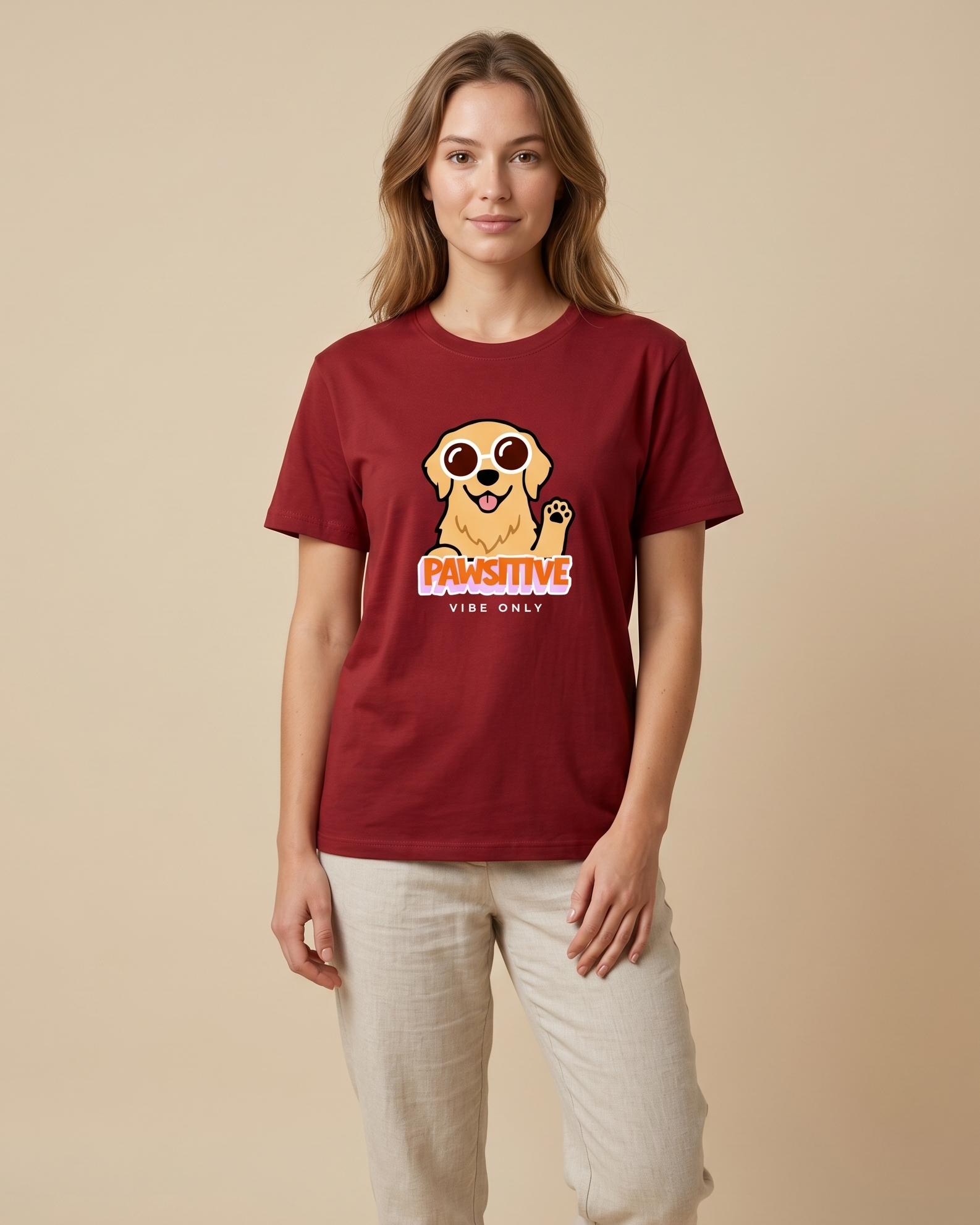 Woman wearing a red t-shirt with a graphic design on a beige background