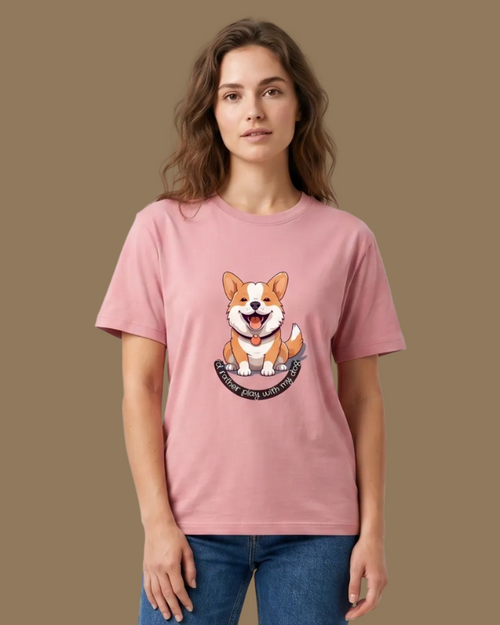 Woman wearing a pink t-shirt with a dog graphic and blue jeans on a beige background