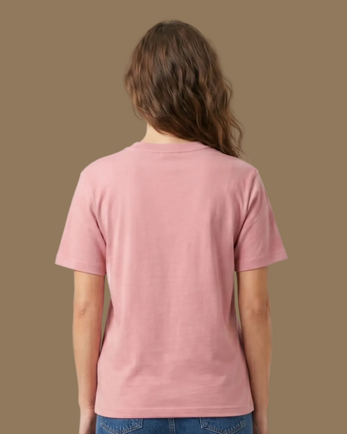 Person wearing a pink t-shirt and blue jeans on a beige background