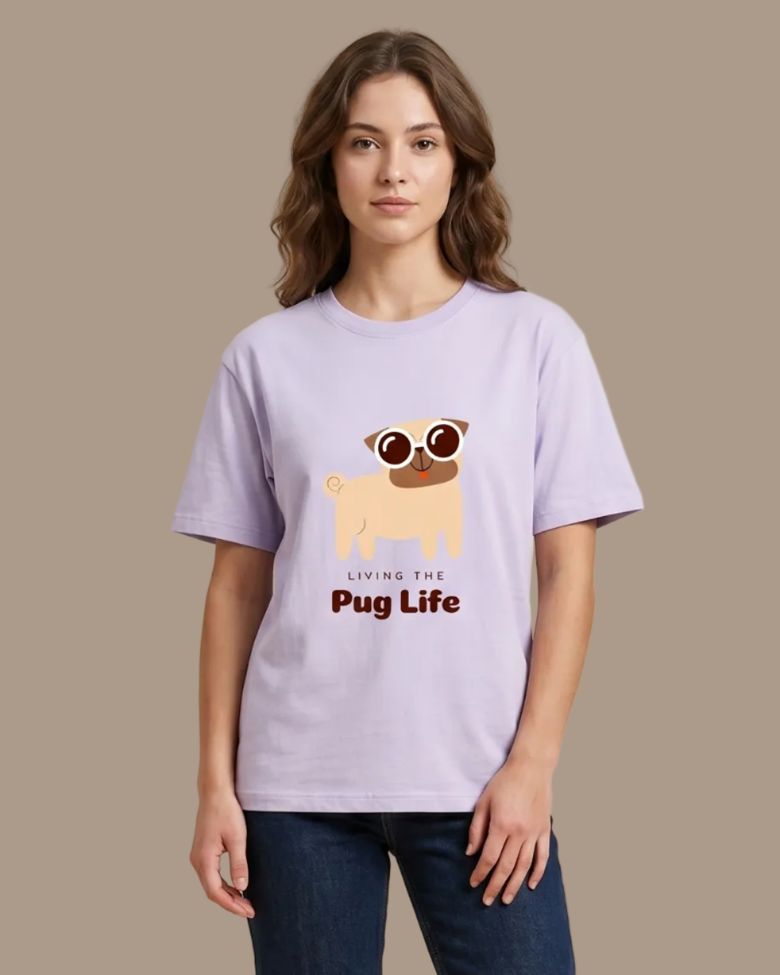 Person wearing a light purple t-shirt with a pug graphic and text on a beige background