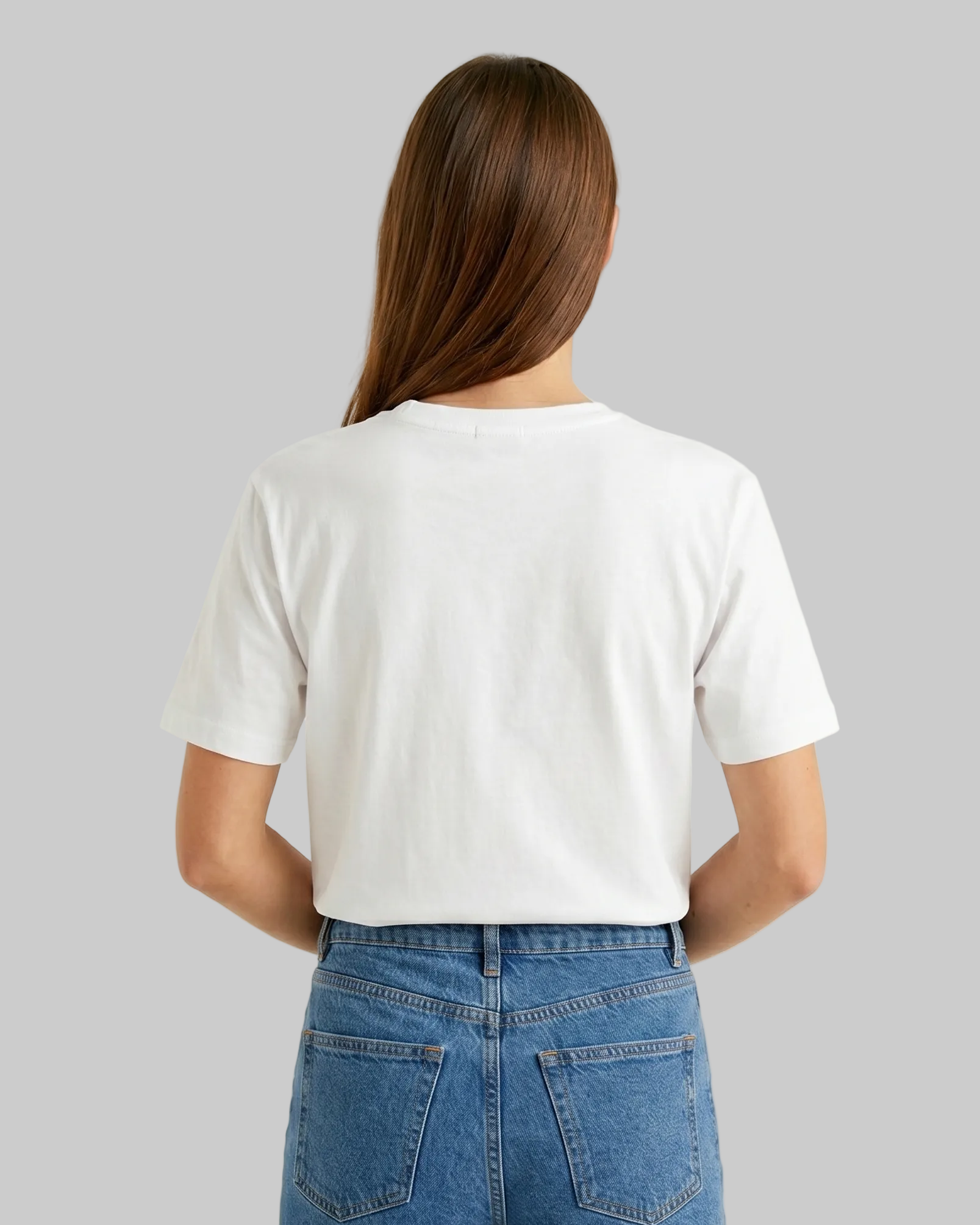 Person wearing a white t-shirt and blue jeans on a plain background